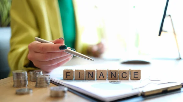 Close Woman Pointing Word Finance Collected Wooden Blocks Row Business —  Fotos de Stock