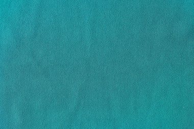 Top view of turquoise smooth fabric cloth texture for background and design art work. Texture backdrop for design art work