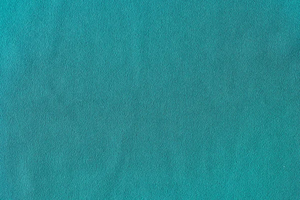 Top view of turquoise smooth fabric cloth texture for background and design art work. Texture backdrop for design art work