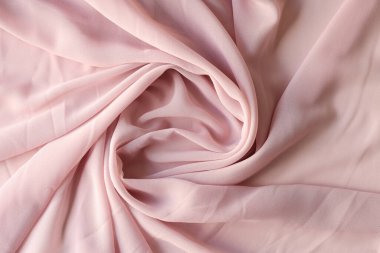 Top view of light pink fabric cloth texture for background and design art work. Rosy pastel crumpled textile surface backdrop