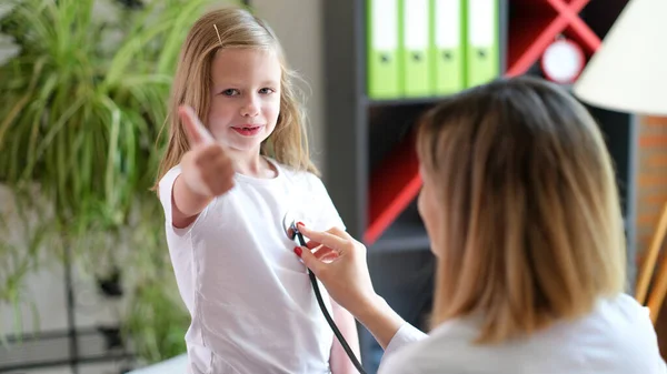 Portrait Happy Cheerful Child Doctor Pediatrician Appointment Showing Thumb Gesture — Zdjęcie stockowe