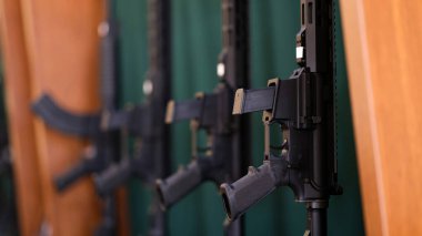 Close-up of set of rifles and carbines in storage. War, army, police and weapon concept