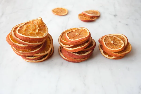 Close Three Stacks Dried Orange Slices Marble Surface — Stock Photo, Image