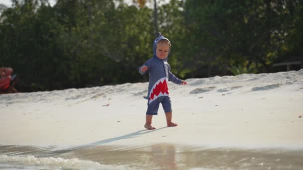 Small Kid Shark Costume Runs Tropical Beach Ocean Smile Camera — Wideo stockowe