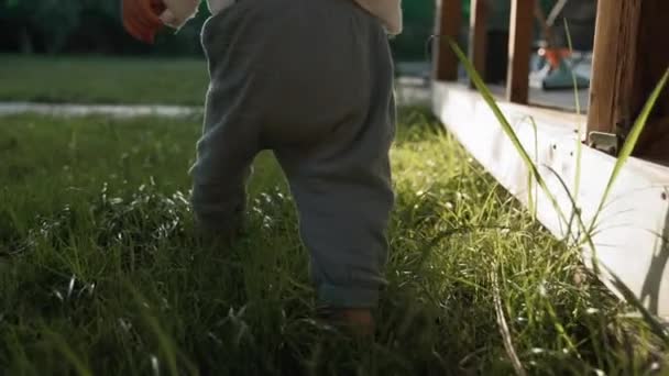 Toddler Walks Barefoot Lush Green Grass Growing House Threshold Little — Vídeos de Stock