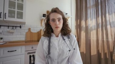 POV of lady family doctor getting shocked covering eyes with hands refusing to look in camera. Young woman shows scared facial expression closeup