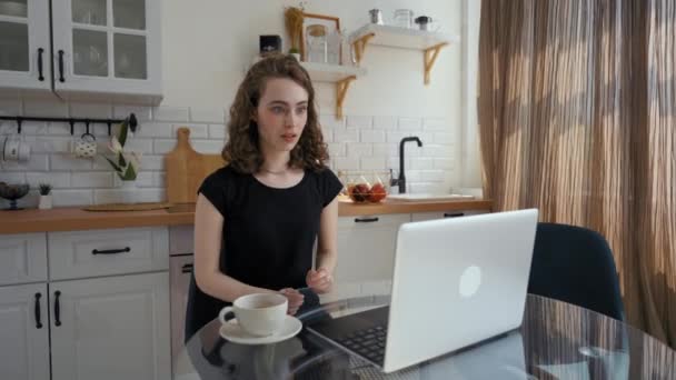Woman Watches Movie Laptop Getting Shocked Scary Moment Young Curly — Vídeos de Stock