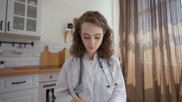 Pov Family Doctor Writing Details Listening Patient Video Call Woman — Video Stock