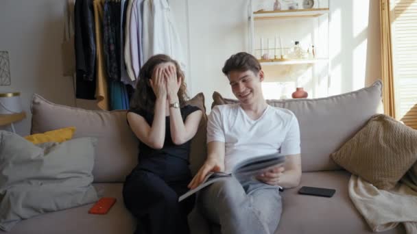 Woman Tells Funny Stories Watching School Album Partner Weekend Young — Video Stock