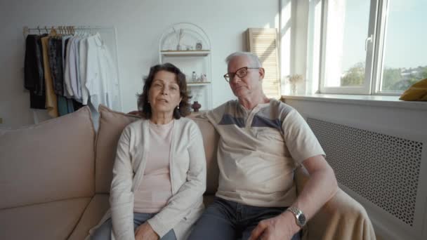 Senior Family Couple Speaks Health Issues Camera Sitting Sofa Living — Video