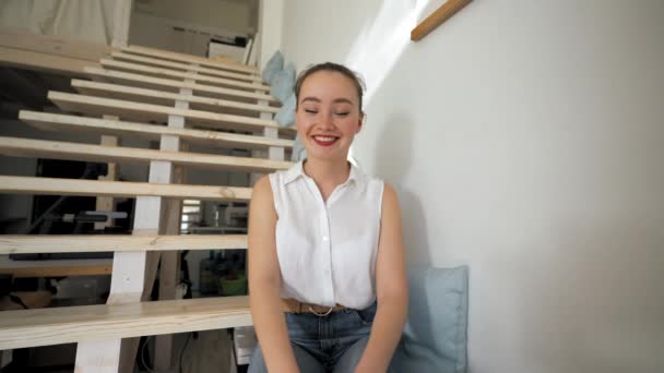 Young Woman Enjoys Talking Boyfriend Video Call Sitting Wooden Stairs — Video