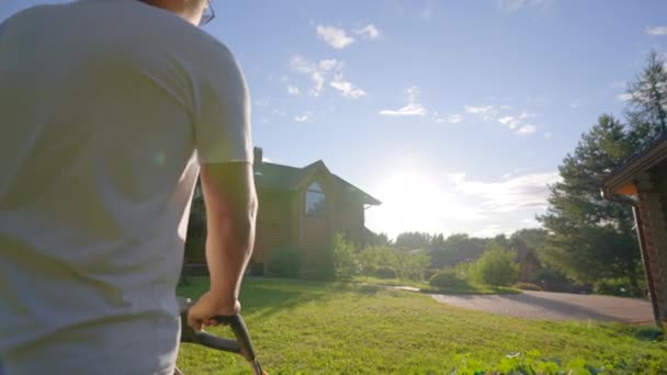Man Takes Care Yard Cutting Grass Mower Blue Sky Strong — Vídeo de stock