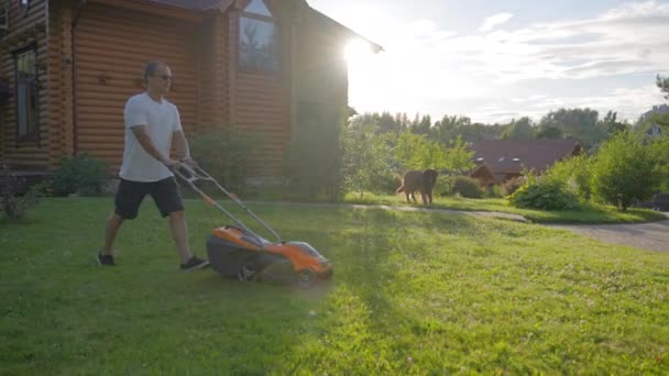 Middle Aged Man Enjoys Taking Care Big Yard Lawn Mature — Vídeos de Stock