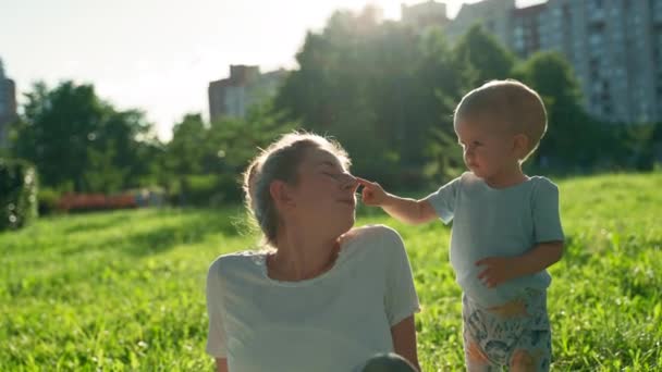 Happy Toddler Boy Plays Women Park Child Touches Noses Mother — Stok video