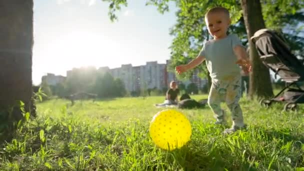 Toddler Boy Plays Large Yellow Ball Happy Child Smiles Laughs — Video Stock