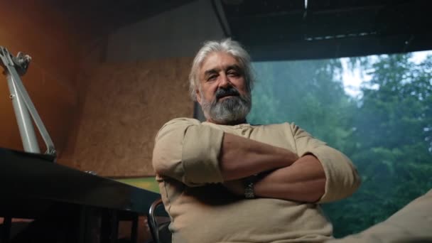 Grey Haired Man Sits Garage Looking Satisfied Expression Senior Bearded — Vídeo de stock