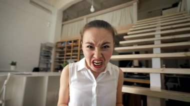 POV of irritated woman screaming on video call with employee looking in camera. Young manager scolds worker for failed project closeup