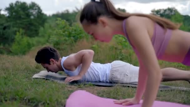 Young Sporty People Practice Yoga Asana Upward Facing Dog Together — Wideo stockowe