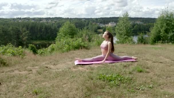 Sporty Woman Sits Twine Raised Hands Sunny Weather Lady Stretches — Stock videók