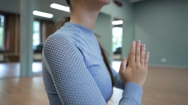 Young Woman Glasses Sits Mat Lotus Pose Hands Prayer Gesture — Stok video
