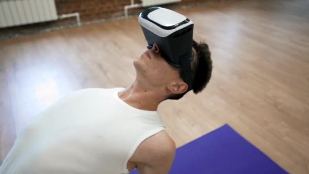 Man Virtual Reality Glasses Leans Back Doing Yoga Camel Pose — Stok video