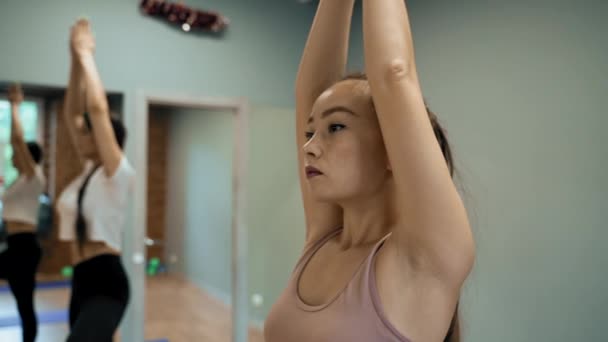 Women Sportswear Stand Tree Poses Blue Mats Raising Hands Sportive — Stok video