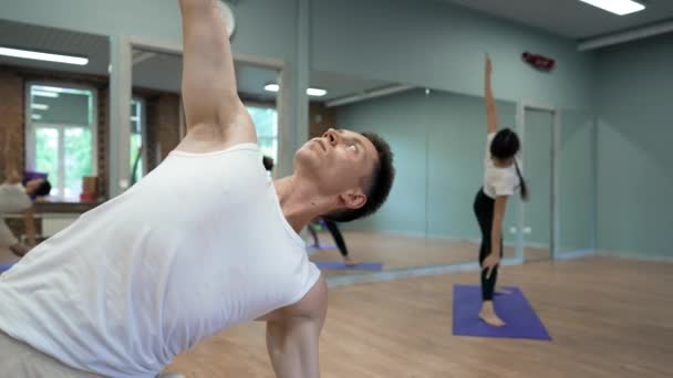 Young Coach Stands Yoga Pose Triangle Spread Hands Showing Effective — Stock videók