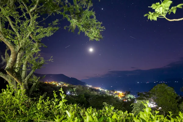 2 Shooting stars cossing the new moon dawn in the early night sky