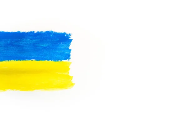 Flag of Ukraine is yellow-blue on a white background painted with paints. Flag day. Support for Ukraine. There is no war. Peace in Ukraine. Copyspace. — Stock Photo, Image