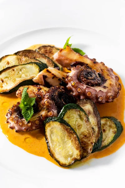cooked octopus, served with courgettes and sauce