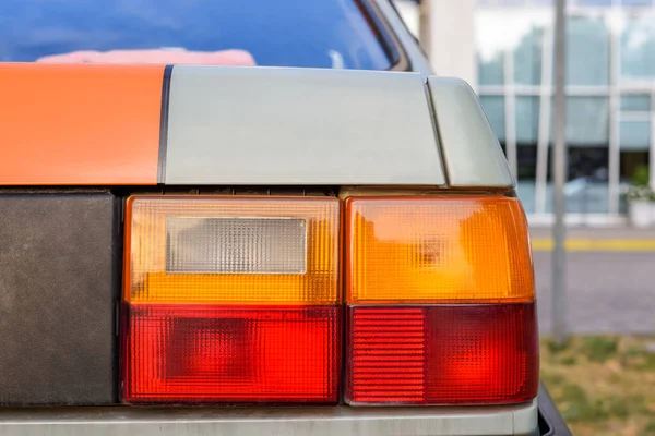 Tail lights and brake lights of an old classic car model.