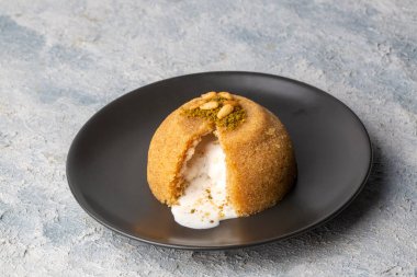traditional turkish dessert with ice cream on a plate