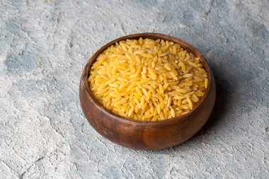 raw uncooked rice in bowl