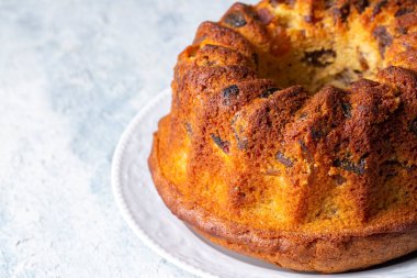homemade cake with raisins on white plate