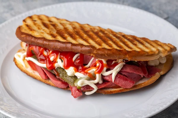 Sandwich Sausage Cheese Pickled Cucumber Ketchup Mayonnaise White Plate — Zdjęcie stockowe