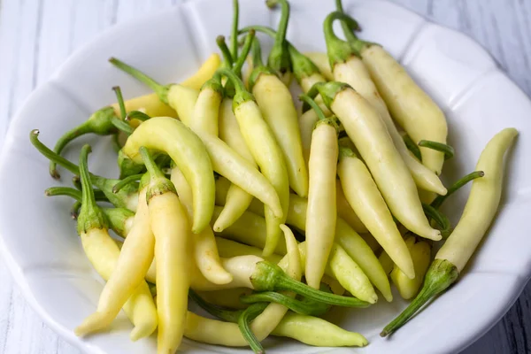 Fresh Raw Peppers White Plate — ストック写真