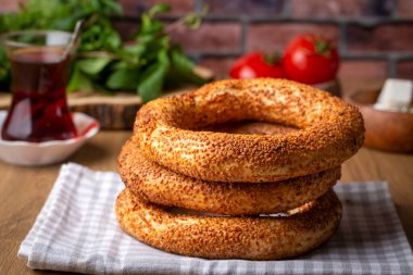 Turkish fast food bagel called Simit. Turkish bagel Simit with sesame. Bagel is traditional Turkish bakery food. Turkish name; simit - gevrek clipart