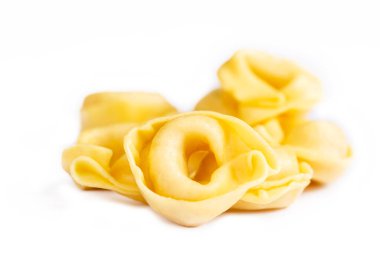 Raw fresh tortellini pasta isolated on white background