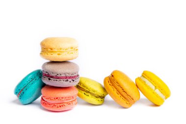 Colorful macaroon cakes. Small french muffins. Colorful macarons on a white background