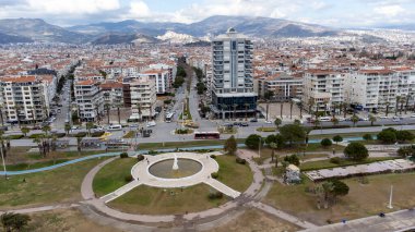 Karsiyaka - Izmir - Turkey, March 20, 2022, Around the Yunuslar statue with an aerial view of the city and the sea with drone