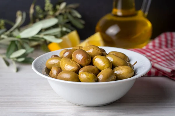 Cracked green olives. Cracked green olives with lemon. Turkish style olive (Turkish name; kirma zeytin)