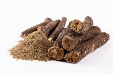 Licorice and licorice powder on the white background