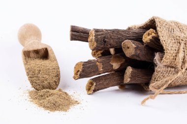 Licorice and licorice powder on the white background