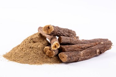 Licorice and licorice powder on the white background