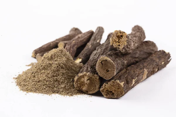 Licorice and licorice powder on the white background