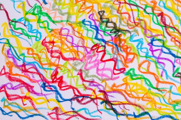 Colorful pastel crayons with painting background