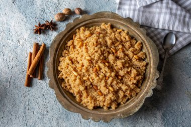 Traditional Turkish desserts; Semolina halva with orange (Turkish name; portakalli irmik helvasi)