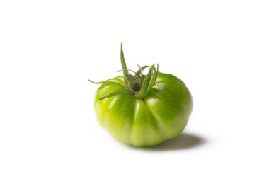 Green organic tomatoes on the white background