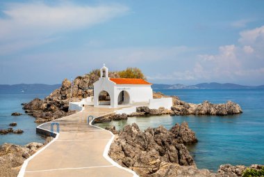Authentic traditional Greek islands- unspoiled Chios, little church in the sea over the rocks Agios Isidoros. Eastern Aegean islands