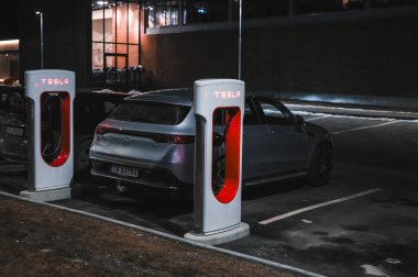 Sandefjord, Norway - februar 25, 2022: Silver Mercedes EQC Parked At Tesla Supercharger Station. The Mercedes EQC Is A Full-sized All-electric Five-door SUV